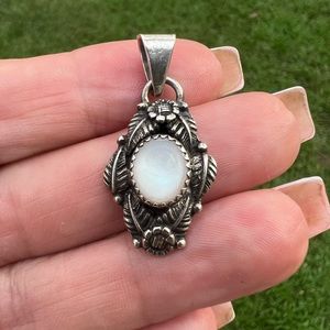 Vintage Sterling Silver Native American Circle JW 
Mother of Pearl Pendant